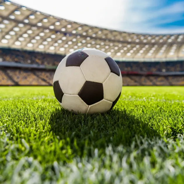 close-up-view-of-soccer-ball-on-grass-on-soccer-fi-2023-11-27-05-22-23-utc~2